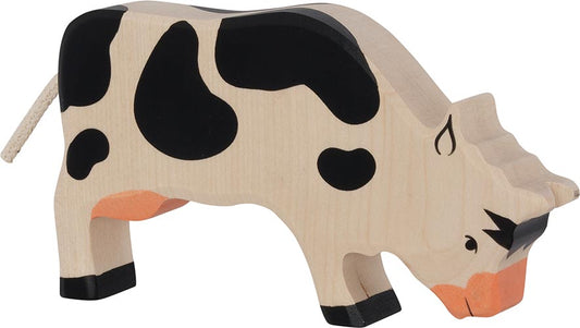 Holztiger Kuh grasend, schwarz